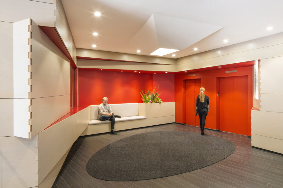 hinged angled wood wall panel elevator lobby