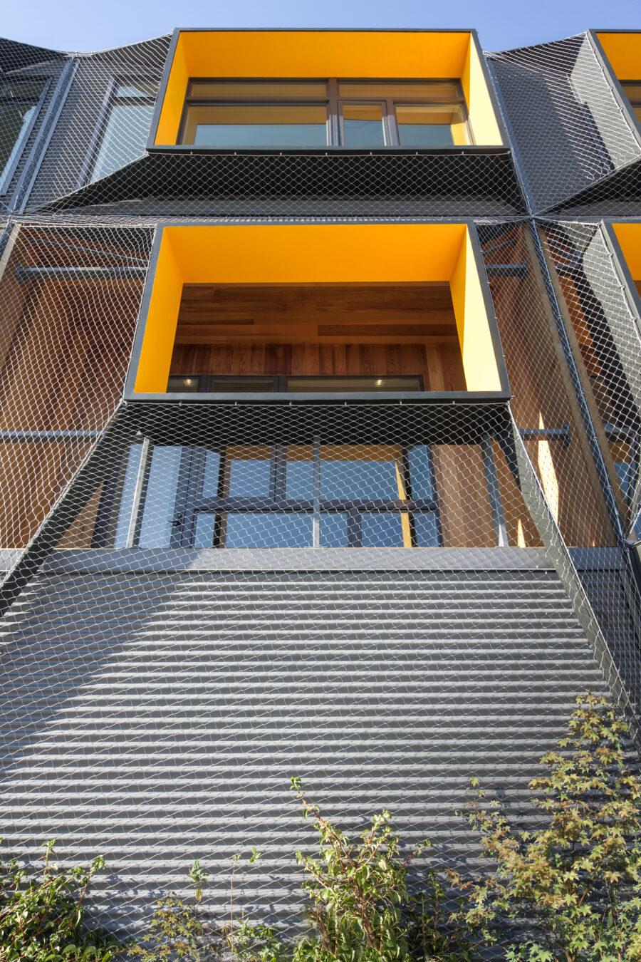 mesh facade recessed balcony cedar