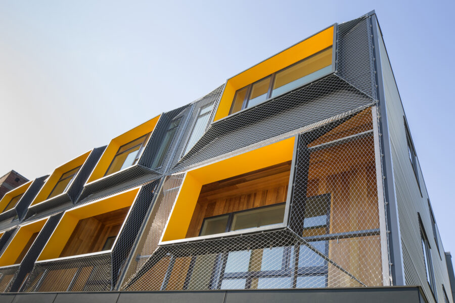 shrink wrap mesh facade cedar balconies