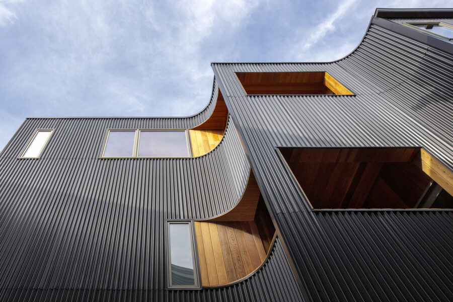 curved corrugated metal recessed balconies