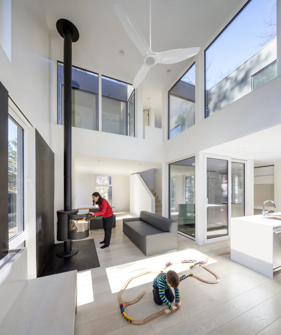 double height living room fireplace clerestory windows