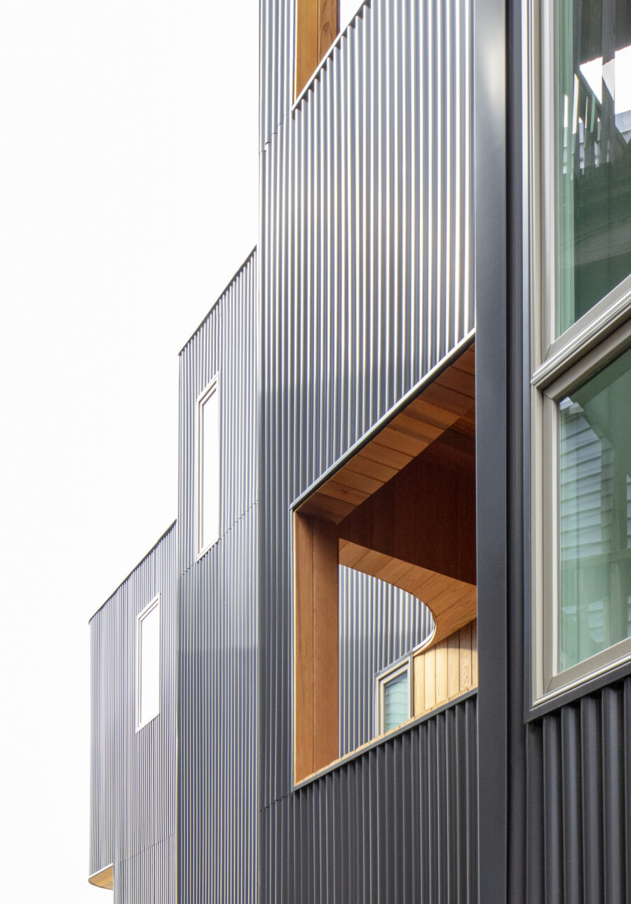 curved corrugated metal recessed balconies