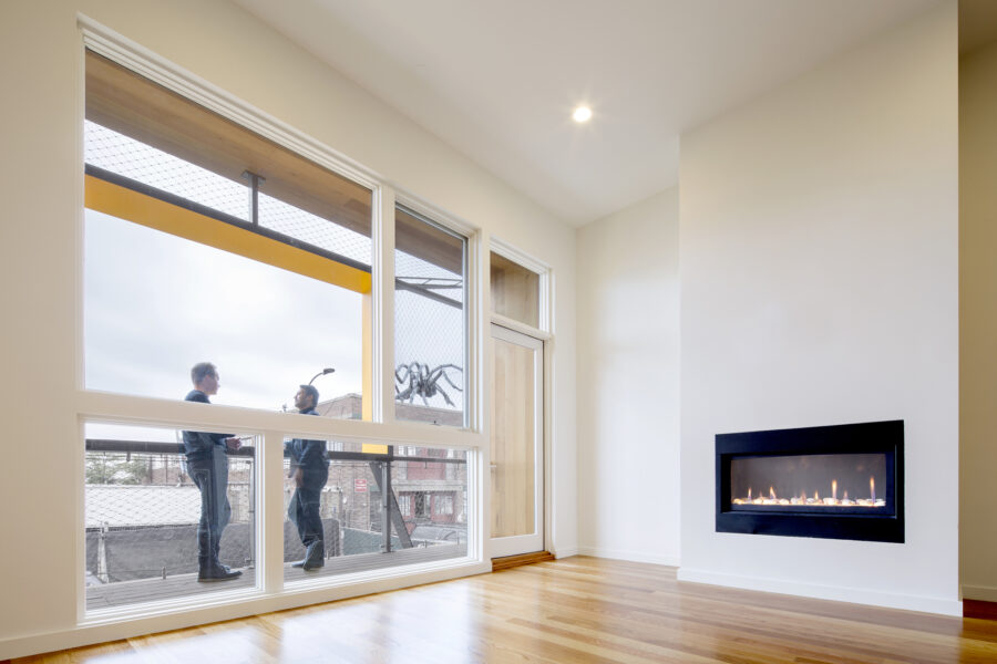 living room double height balcony fireplace