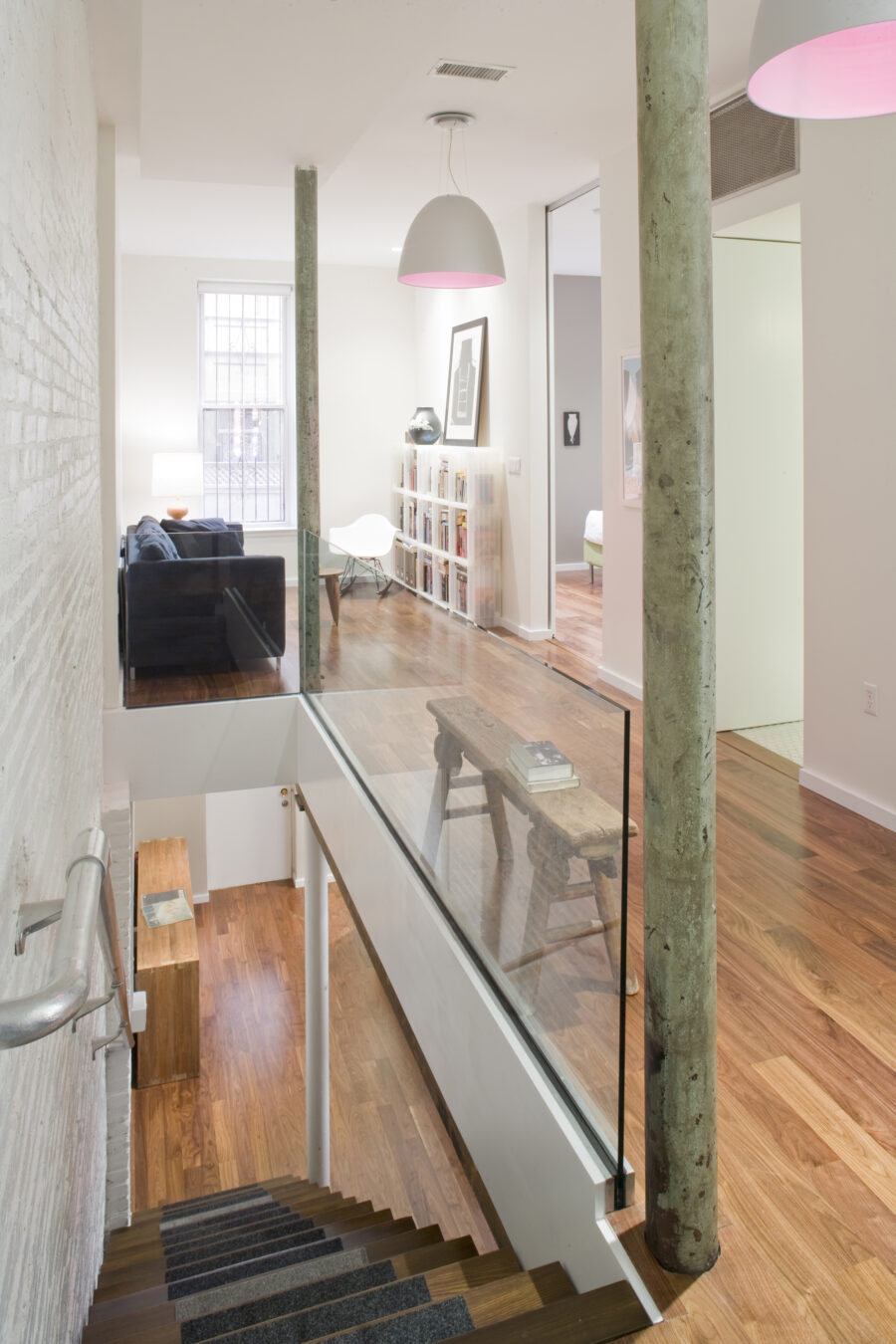 stair with glass railing pink pendant lights