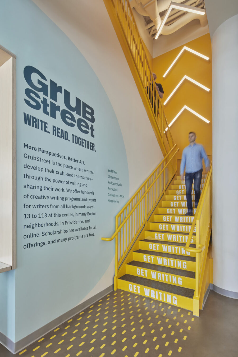 yellow stair bold graphics light fixture arrows