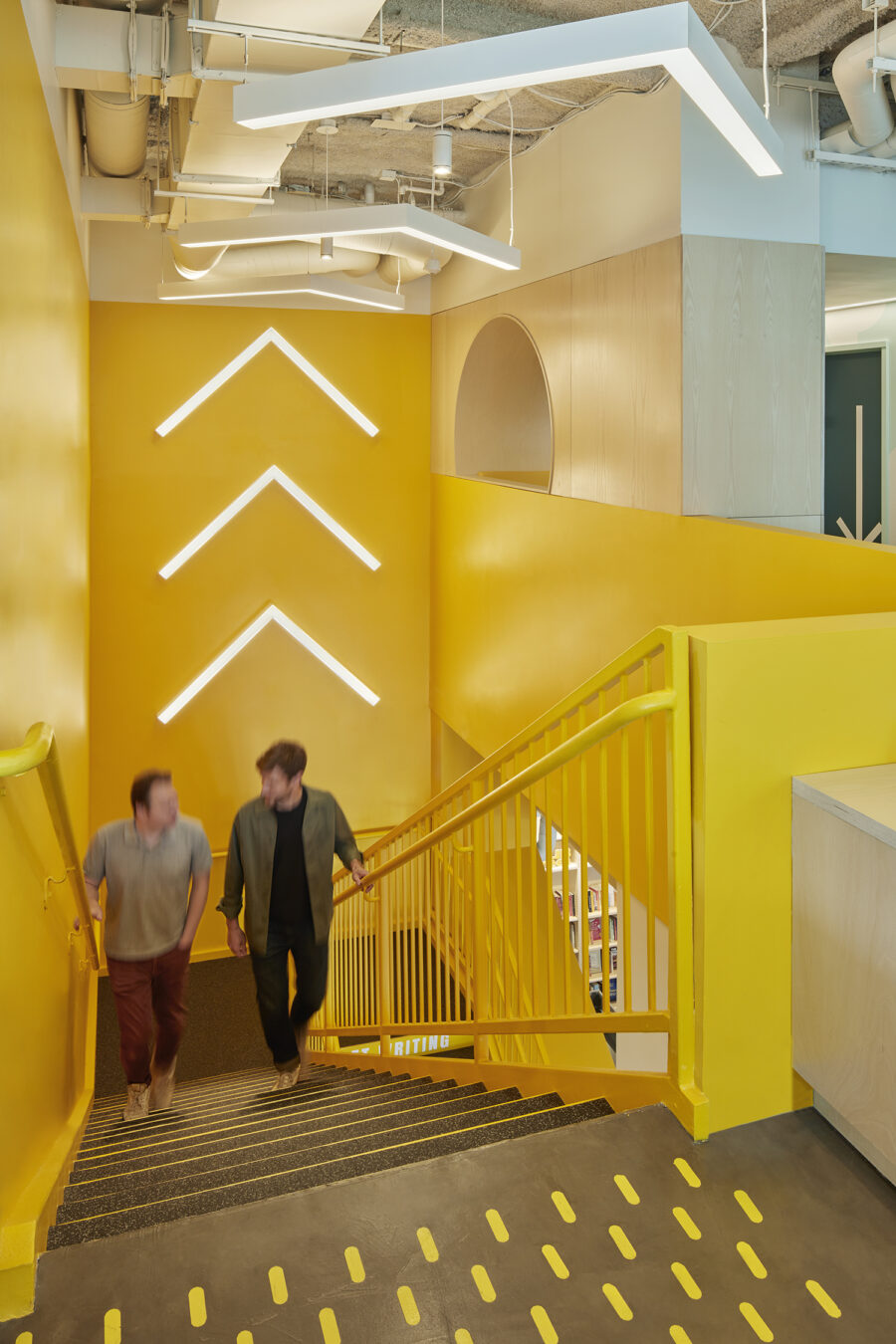 yellow stair light fixture arrows