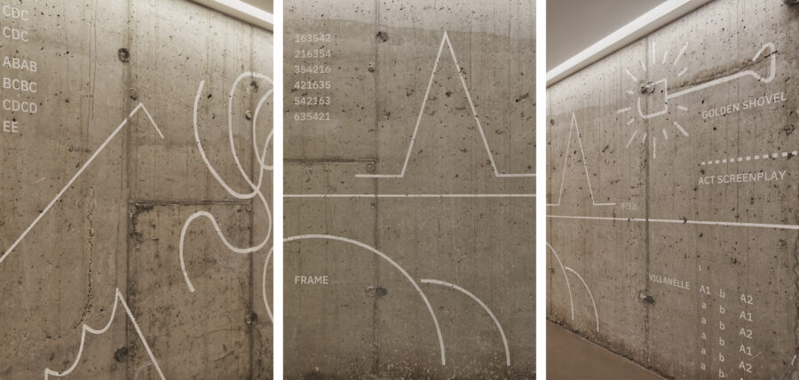 wayfinding graphics on concrete wall