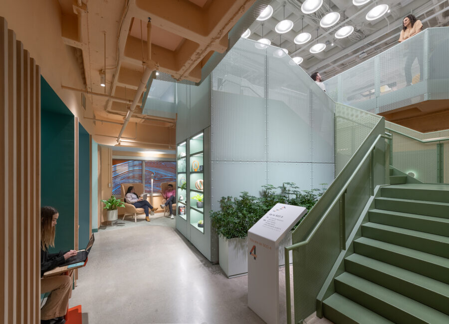 Lounge with connecting stair and perforated metal surround