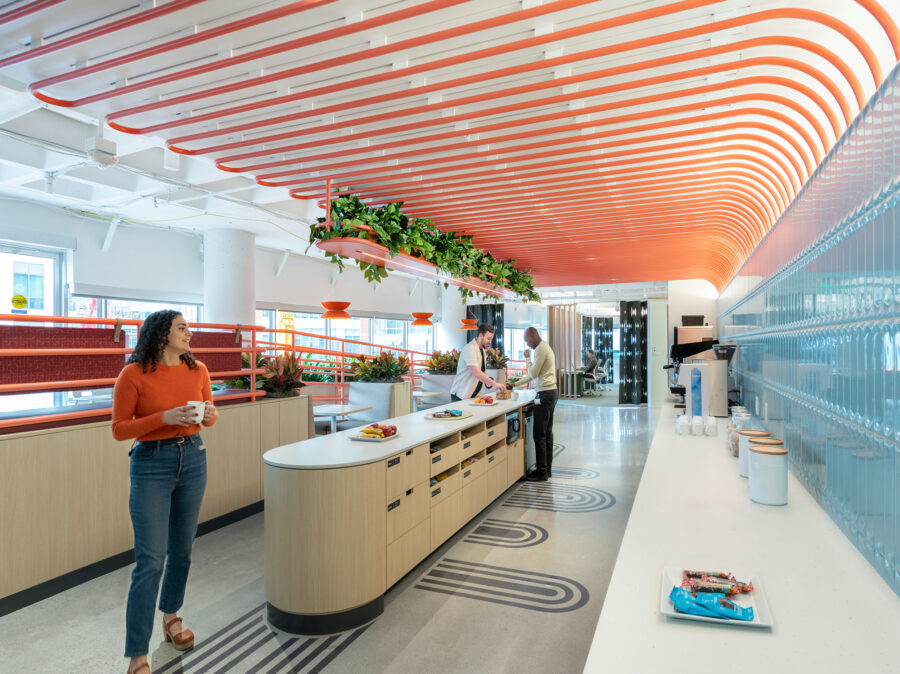 Micro kitchen with orange ceiling rods