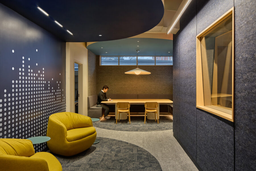 social spine with deep blue carved seating zones