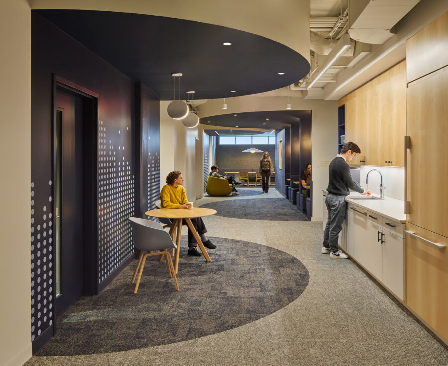 social spine with deep blue carved seating zones